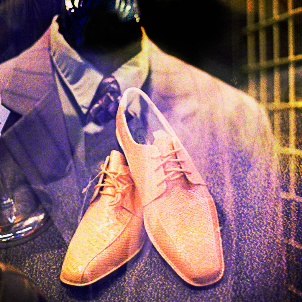 Photo of a man's suit and shoes